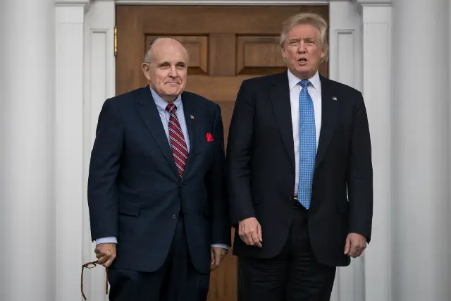 Did Giuliani have to hold Trump's hand walking down stairs too?